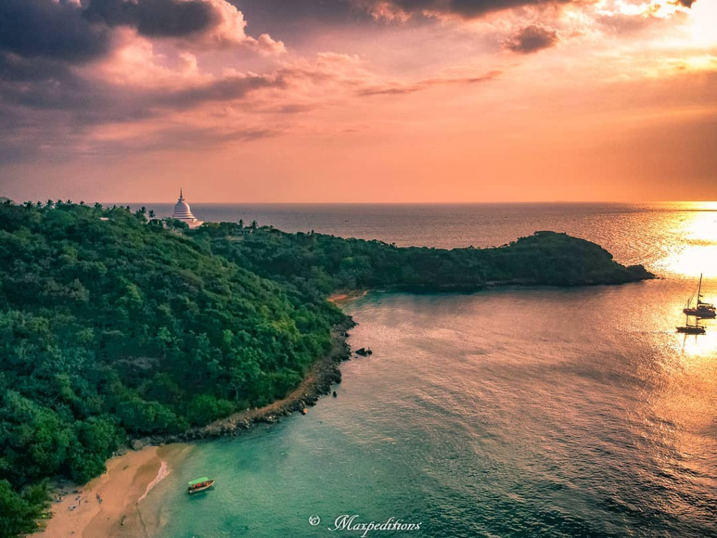 Jungle Beach in Unawatuna, Sri Lanka, surrounded by lush tropical greenery