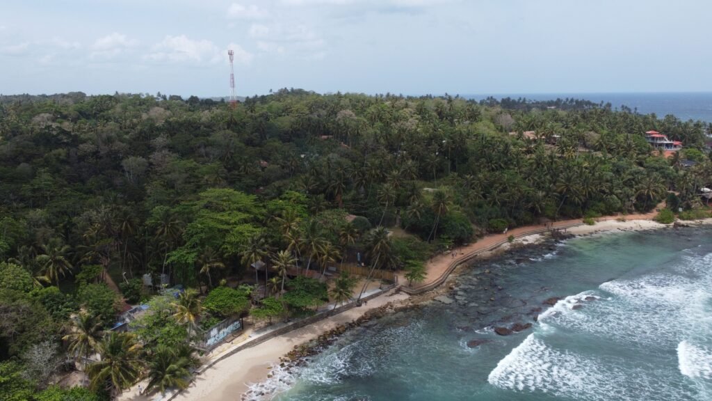 Hiriketiya Beach sandy shore and blue ocean